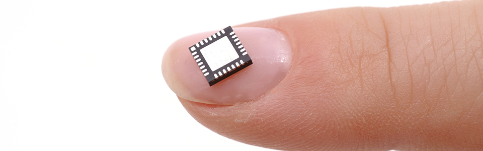 Microprocessor on girls fingertip