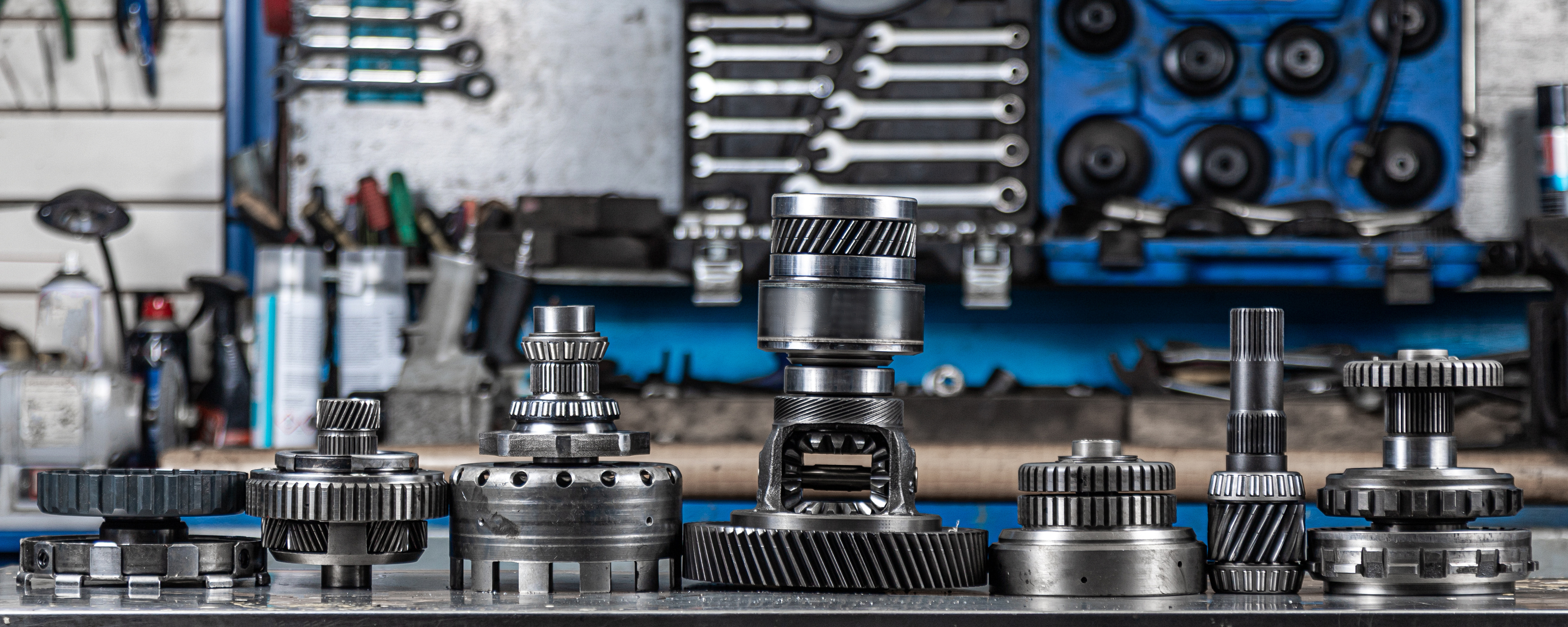 Set of various engine and gearbox spare parts. Shiny gears for planetary gearbox.Metal autotechnology background. wheel engine gears, close up